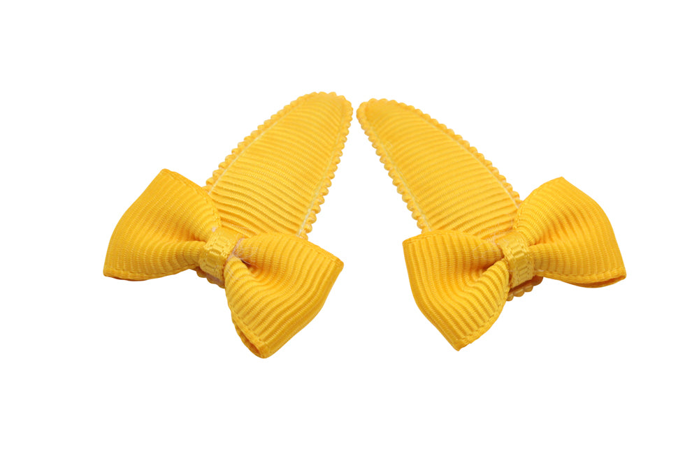 Baby haarspeldjes met strikjes - warm geel