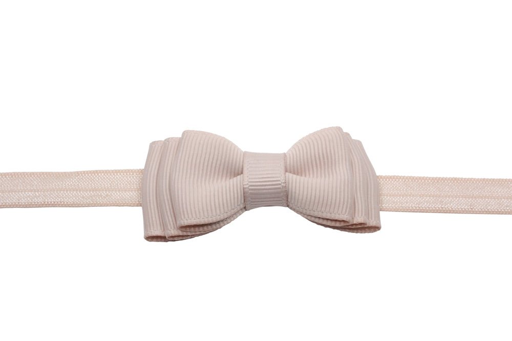 Babyhaarbandje strikje vanille - Staartjes en Strikjes