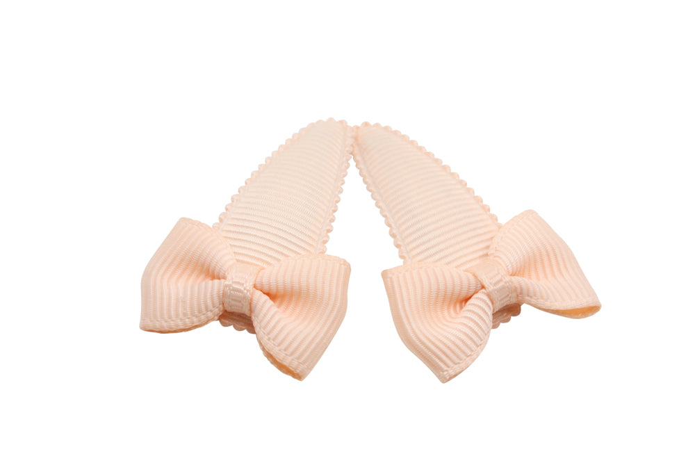 Baby haarspeldjes met strikjes - licht zalmroze