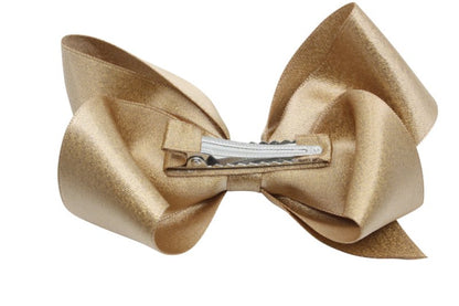 Grote haarstrik – oud goud met glittertje - Staartjes en Strikjes