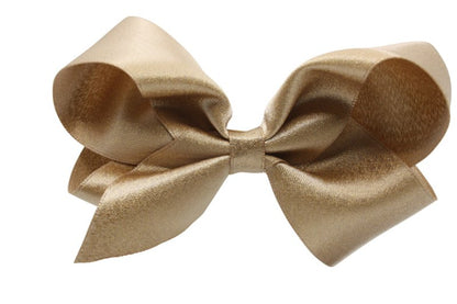 Grote haarstrik – oud goud met glittertje - Staartjes en Strikjes