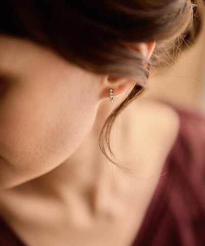 Oorbellen Blomdahl titanium boogje goudkleurig met pareltjes en kristallen – 10 mm - Staartjes en Strikjes