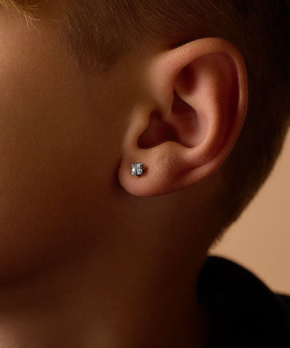 Oorbellen Blomdahl titanium goudkleurig knopje 5 mm. aqua zirconiasteentje - Staartjes en Strikjes