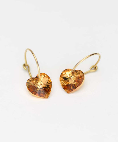 Oorbellen Blomdahl titanium goudkleurige oorringen – 14 mm kristallen hartje bronze