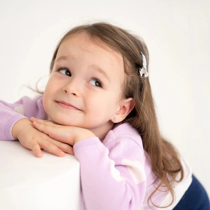 Zilveren kinderoorbellen bloemetjes zirconia | schroefsluiting - Staartjes en Strikjes