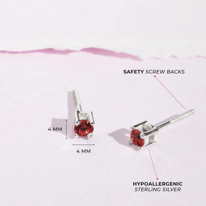 Zilveren kinderoorbellen knopje zirconia 4 mm rood | schroefsluiting - Staartjes en Strikjes