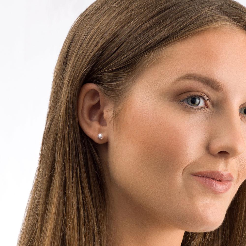 Oorbellen Blomdahl titanium Swarovski parel licht roze 6 mm. - Staartjes en Strikjes